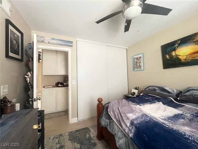 bedroom featuring ceiling fan, visible vents, and a closet