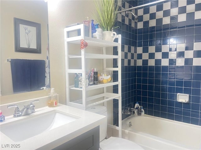 bathroom with  shower combination, vanity, and toilet