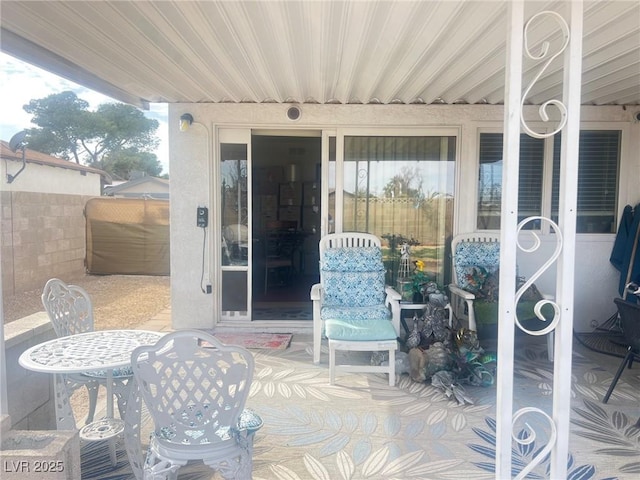 view of patio / terrace featuring fence