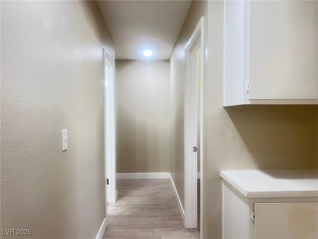 4194 Greenpoint St, Las Vegas, NV 89147 - corridor featuring light wood-type flooring and a textured wall