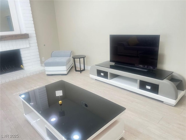 4194 Greenpoint St, Las Vegas, NV 89147 - living area featuring wood finished floors and a fireplace