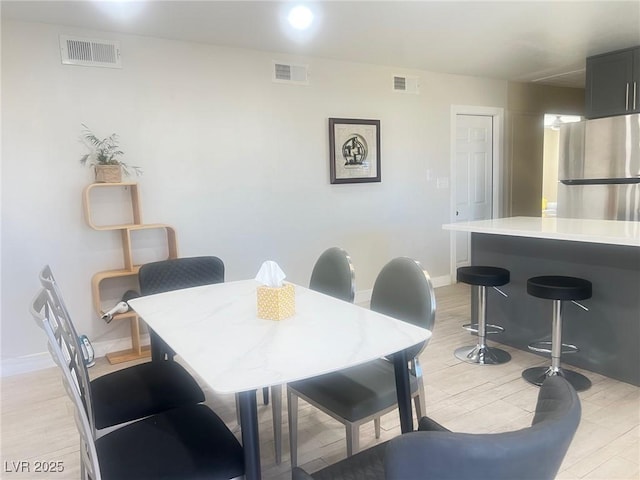 4194 Greenpoint St, Las Vegas, NV 89147 - dining area with baseboards and light wood-type flooring
