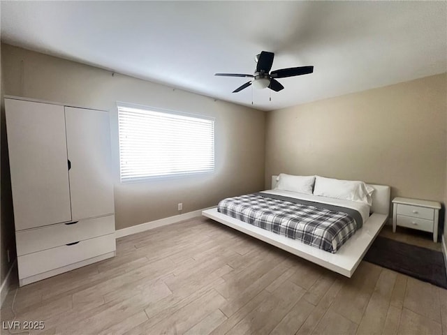 4194 Greenpoint St, Las Vegas, NV 89147 - bedroom featuring light wood-style floors and a ceiling fan