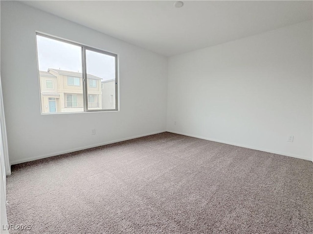 unfurnished room featuring carpet flooring