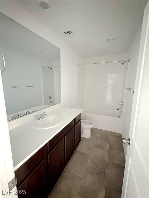 bathroom with toilet, tile patterned flooring, vanity, and visible vents