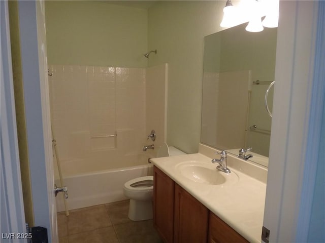 bathroom featuring washtub / shower combination, vanity, toilet, and tile patterned floors