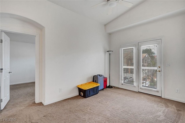 unfurnished room featuring carpet flooring, a ceiling fan, and baseboards