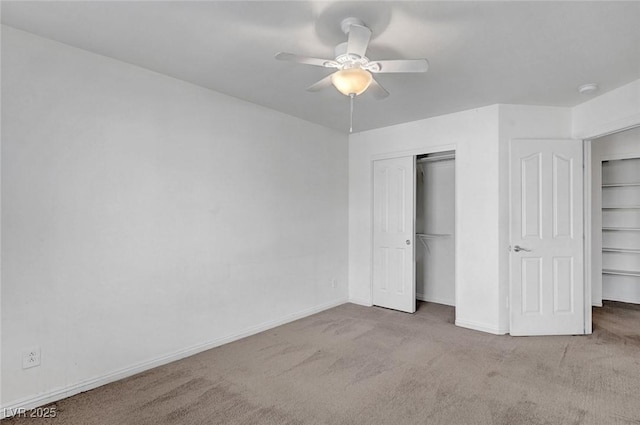 unfurnished bedroom featuring a ceiling fan, carpet, baseboards, and a closet