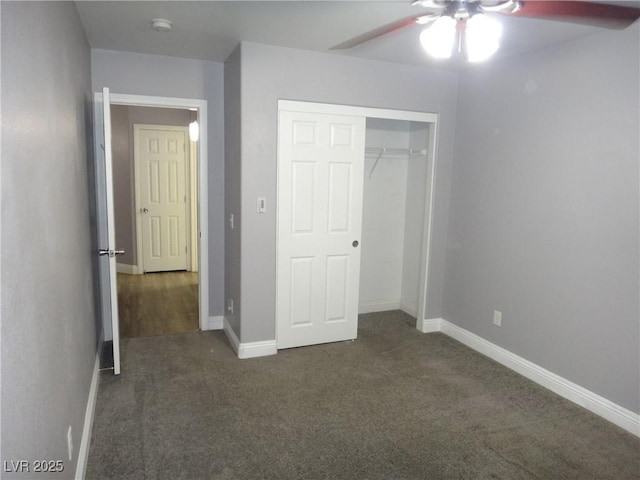 unfurnished bedroom featuring carpet floors, a closet, baseboards, and a ceiling fan