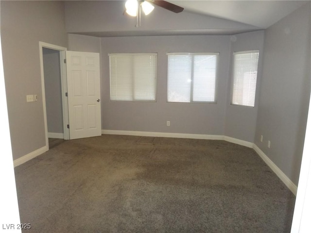 unfurnished room with vaulted ceiling, carpet flooring, a ceiling fan, and baseboards