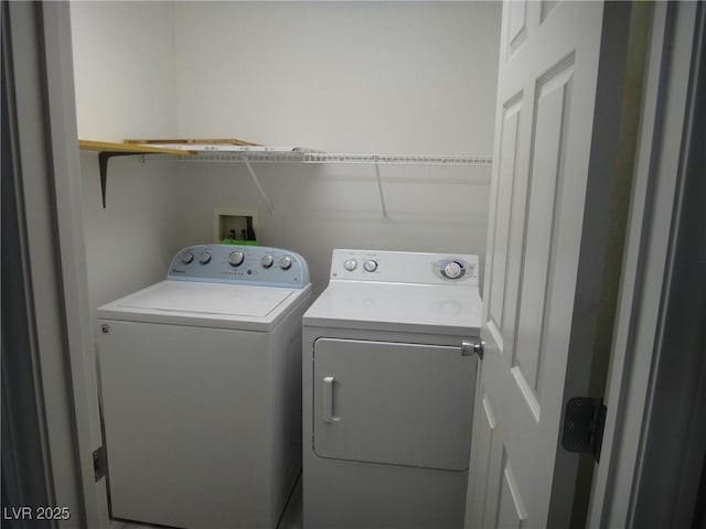 laundry area with laundry area and washer and clothes dryer