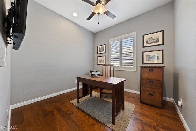 office space featuring a ceiling fan, baseboards, and wood finished floors