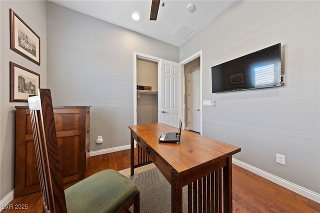 office space featuring dark wood finished floors, baseboards, and ceiling fan