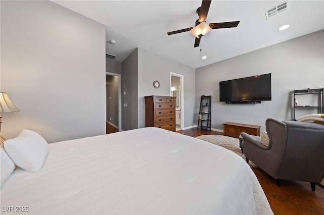 bedroom featuring baseboards, wood finished floors, visible vents, and recessed lighting