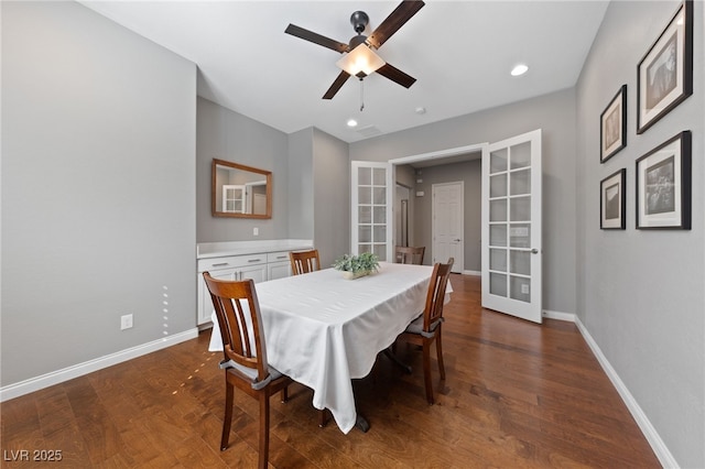 dining room with dark wood-style floors, recessed lighting, and baseboards