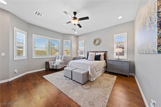 bedroom featuring ceiling fan, baseboards, visible vents, and dark wood finished floors