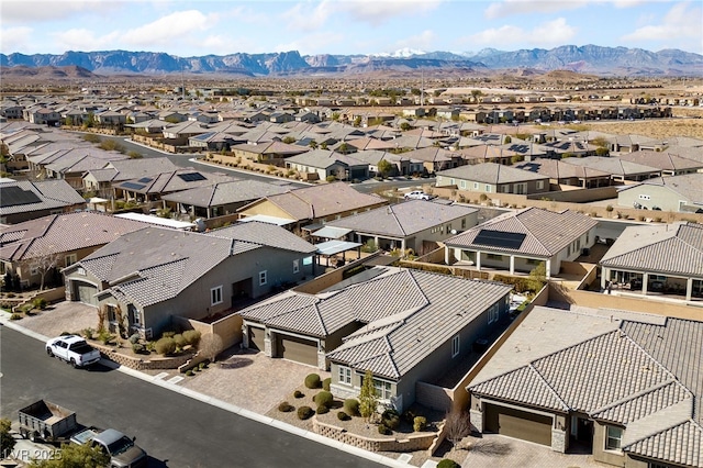 birds eye view of property with a mountain view and a residential view