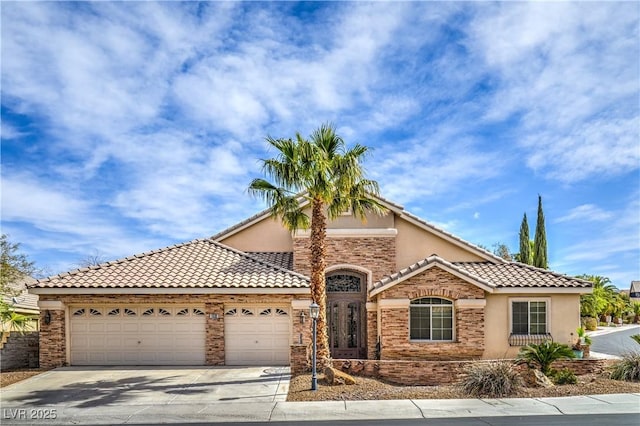 view of front of house with a tile roof, an attached garage, driveway, and stucco siding