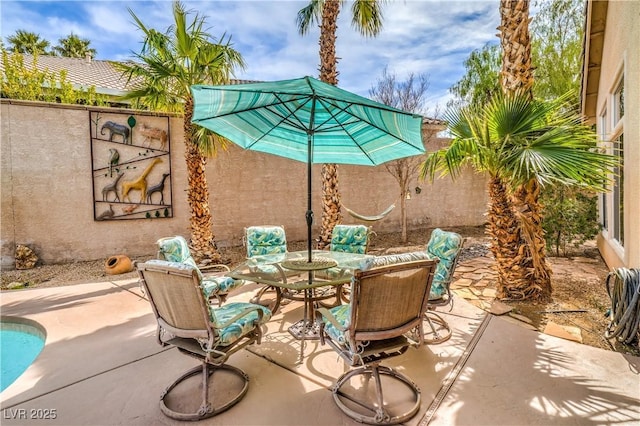 view of patio featuring outdoor dining area