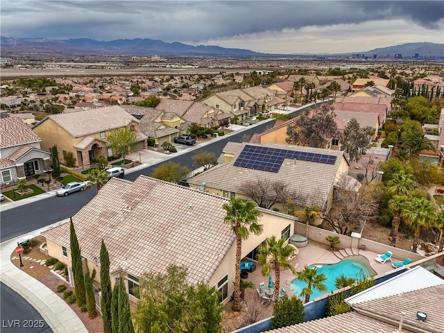 aerial view featuring a mountain view and a residential view