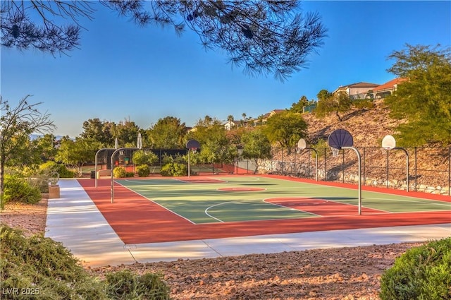 view of basketball court with community basketball court and fence