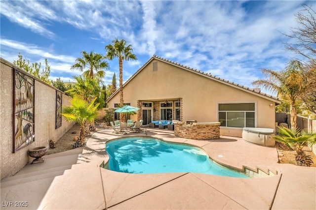 view of swimming pool with an outdoor living space, a fenced in pool, a patio area, and fence