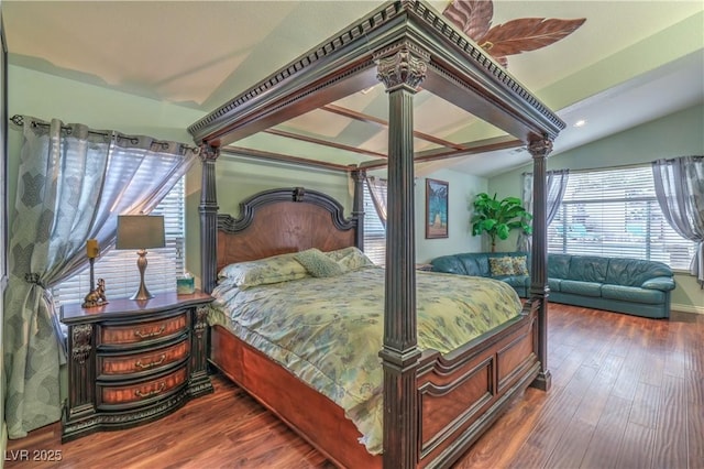 bedroom featuring vaulted ceiling, a ceiling fan, and wood finished floors