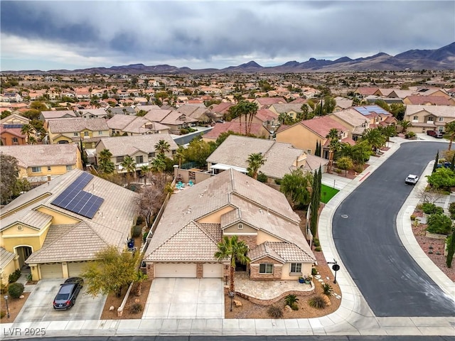 drone / aerial view with a mountain view and a residential view