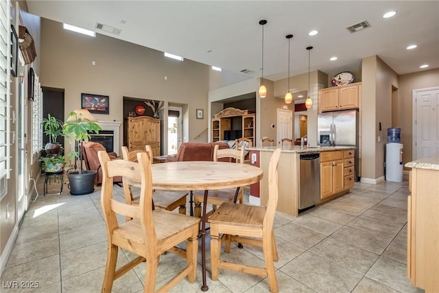 dining room featuring light tile patterned flooring, visible vents, and recessed lighting