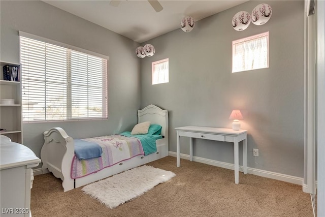 bedroom featuring baseboards, carpet flooring, and a ceiling fan