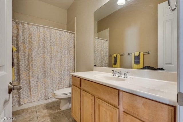 full bathroom featuring toilet, vanity, tile patterned floors, and a shower with shower curtain
