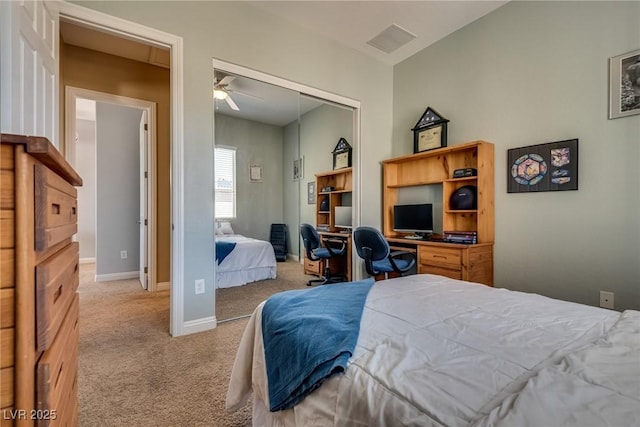 bedroom with a closet, carpet flooring, visible vents, and baseboards