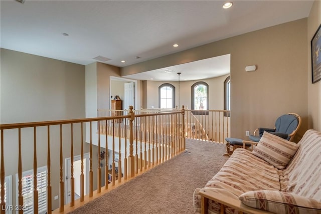 corridor with visible vents, recessed lighting, and carpet