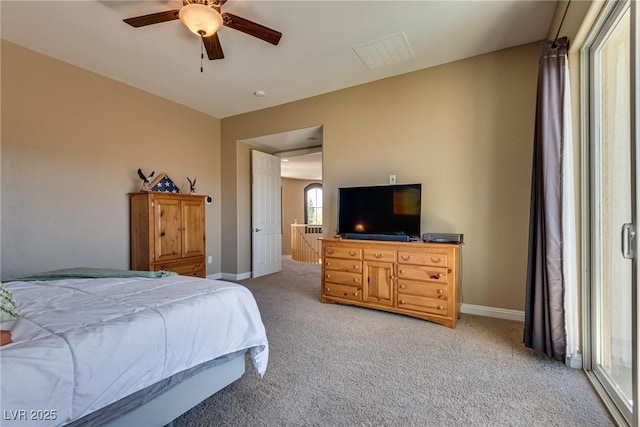 bedroom featuring light carpet, baseboards, and ceiling fan