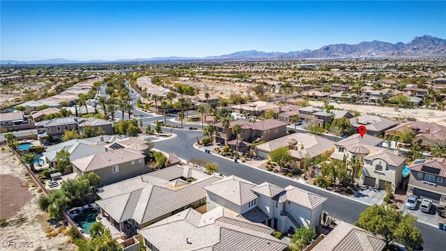 drone / aerial view with a residential view and a mountain view