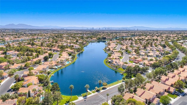 bird's eye view with a water and mountain view and a residential view