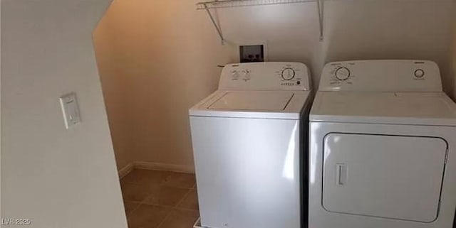 laundry room featuring baseboards, laundry area, washing machine and clothes dryer, and tile patterned floors