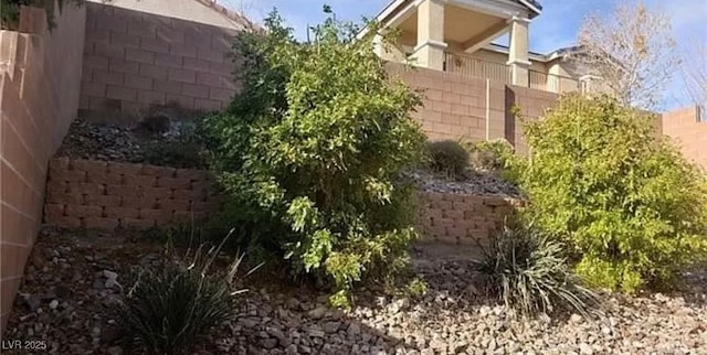 view of side of home with fence