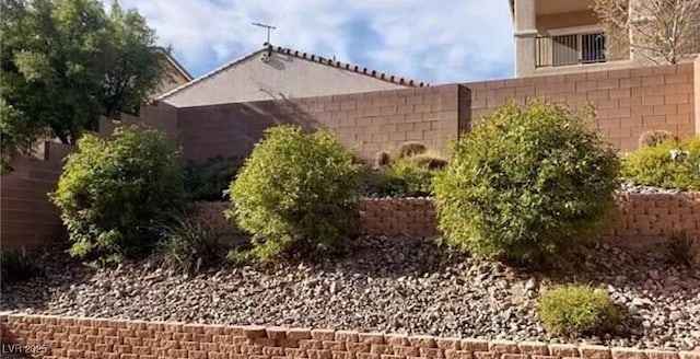 view of side of home with fence