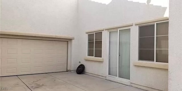 garage featuring driveway