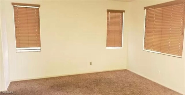 spare room featuring carpet floors