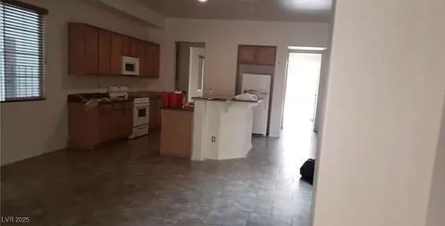 kitchen featuring white appliances and a center island