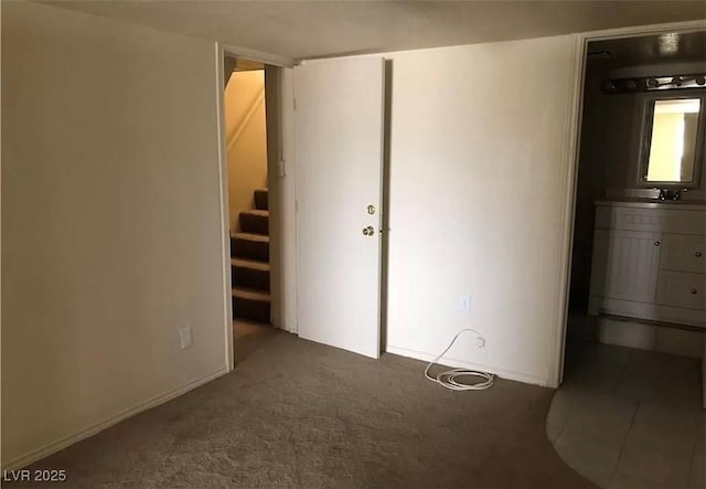 unfurnished bedroom with carpet flooring