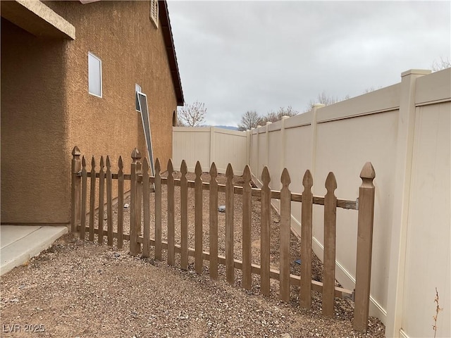 view of gate with fence