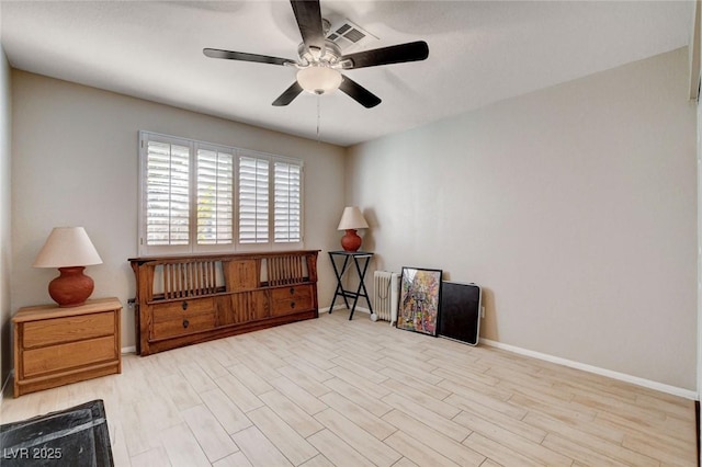 miscellaneous room with visible vents, wood finished floors, a ceiling fan, and baseboards