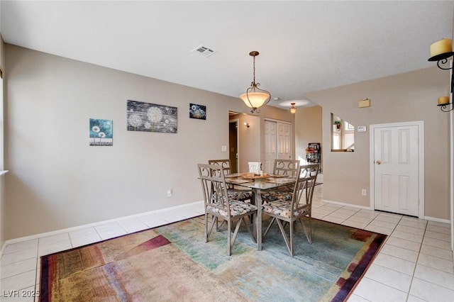 tiled dining space featuring visible vents and baseboards