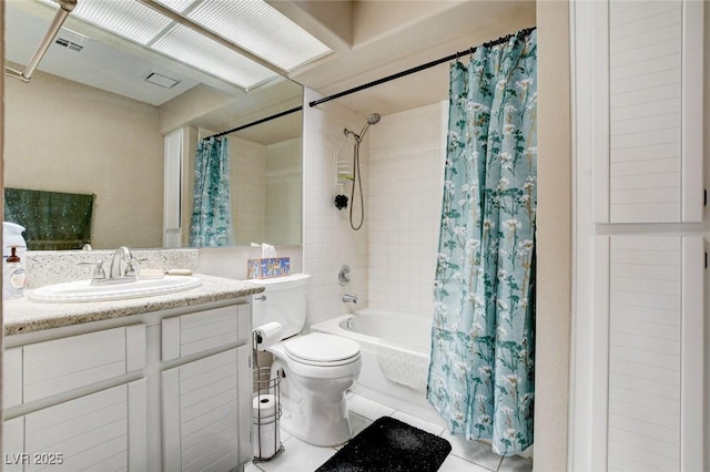 bathroom featuring visible vents, toilet, shower / tub combo, vanity, and tile patterned floors