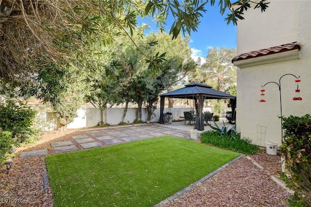 view of yard with a patio, a gazebo, and fence