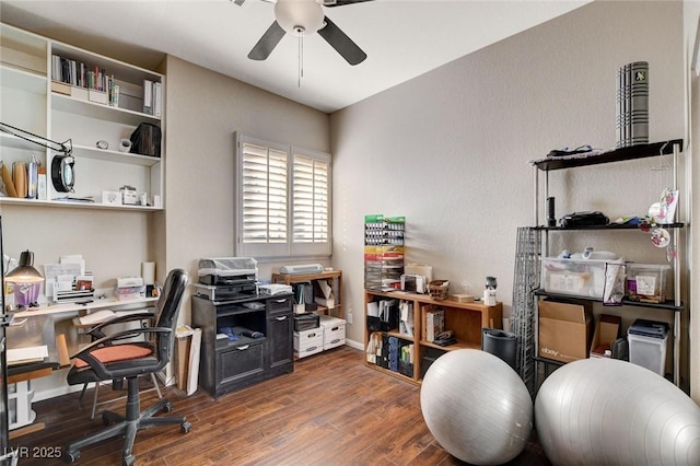 office area featuring a ceiling fan, baseboards, and wood finished floors