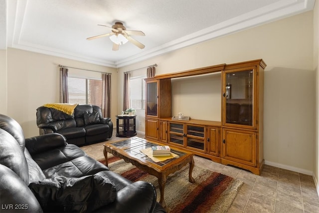 living area featuring ceiling fan and baseboards